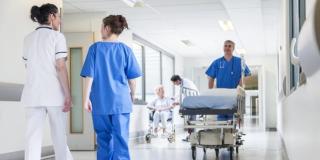 hospital workers in a hallway