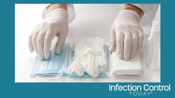 Protective equipment, including surgical masks, gloves, wipes, and sanitizer, is arranged on a table for virus prevention and safety measures. (Adobe Stock2020000743 by rungnapha)