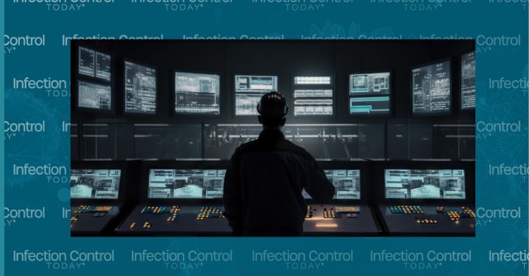 A man standing in front of a large display of computer screens for a wastewater treatment plant.   (Adobe Stock 584945266 by CleverStock) 
