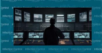 A man standing in front of a large display of computer screens for a wastewater treatment plant. (Adobe Stock 584945266 by CleverStock)