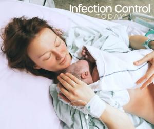 Mother holding her newborn after labor in a hospital.   (Adobe Stock 138706505 by nataliaderiabina)