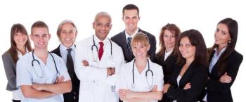 hospital staff smiling at the camera.