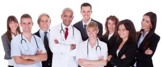 hospital staff smiling at the camera.