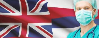 health care worker standing in front of Hawaiian flag