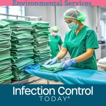 A health care worker in a green uniform carefully organizes freshly laundered hospital linens.  (Adobe Stock 953648078 by Diana)