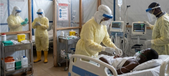 Health care workers tending to an Ebola patient.  (Image credit: Brayden Unger with AI)