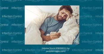 Ill man lying in bed looking at a thermometer.  (Adobe Stock 658266311 by peopleimages.com)