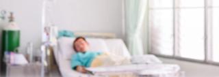 Child in hospital bed. blurry