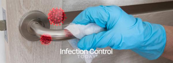 Wiping the doorknob with an antibacterial disinfecting wipe.  (Adobe Stock 335076729 by Shi)
