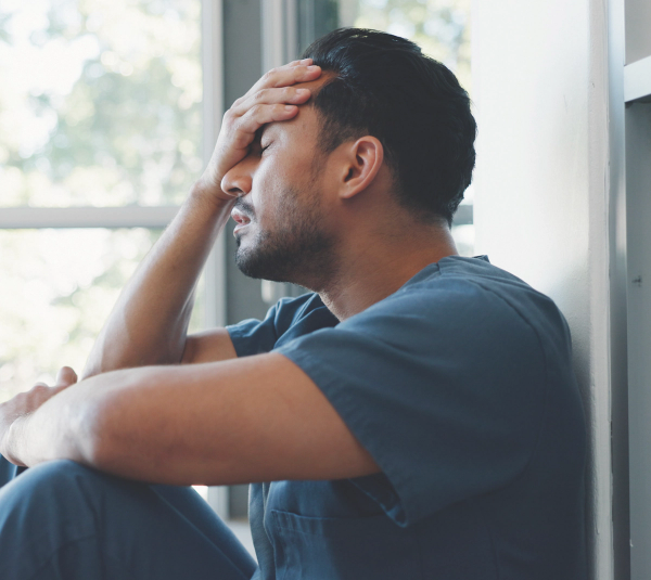 Infection prevention expert is tired and burnt out (Adobe Stock 566595247)