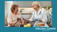 A female doctor holding a syringe explaining the vaccine to a senior patient.  (Adobe Stock 906510348 by Maria Vitkovska)