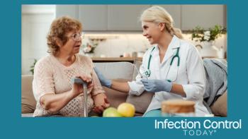 A female doctor holding a syringe explaining the vaccine to a senior patient. (Adobe Stock 906510348 by Maria Vitkovska)