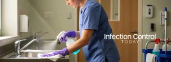 Health care worker disinfecting a stainless steel sink in a medical facility for hygiene (Adobe Stock 1692271572 by Digion)