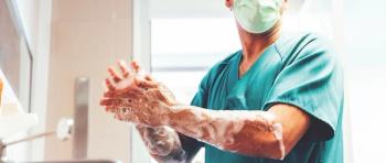 A surgeon performing hand hygiene. 