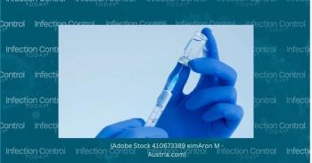 Health care worker holding a vaccine needle.  (Adobe Stock 410673389 by Aron M - Austria)