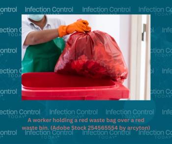 A worker is holding a red waste bag over a red waste bin. (Adobe Stock 254565554 by arcyto)