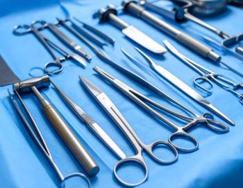 A complete set of stainless-steel surgical instruments placed on a sterile blue drape, ready for medical use.  (Adobe Stock 1557031822 by Rahmat Hidayat) 