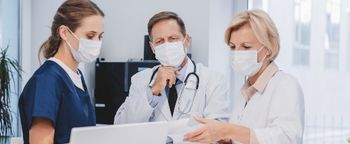 infection preventionists standing, having a meeting
