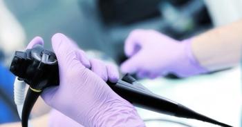 Picture of health care worker holding endoscope