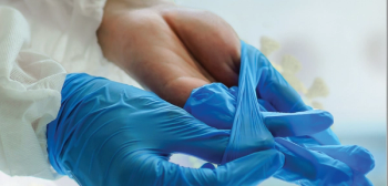 putting on medical grade gloves