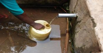 Drawing from a water source in rural Kenya: Water sources may be a significant f