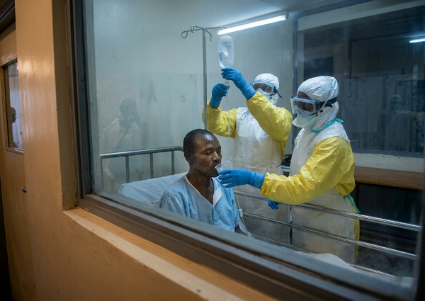 Kenyan patient with Ebola being treated by health care workers.   (Image created by author with AI)