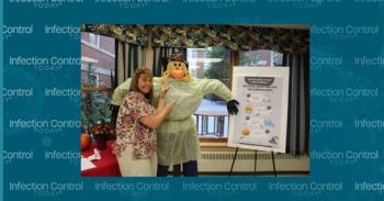 Author with scarecrow (Photo courtesy of author)