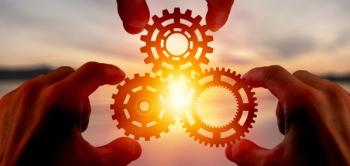 Collaboration.  Three hands holding wheels whose cogs intermingle