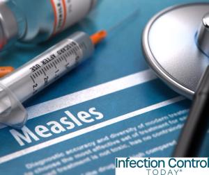 Measles—medical concept with blurred text, stethoscope, pills, and syringe on a blue background.  (Adobe Stock 104182067 by tashatuvango)