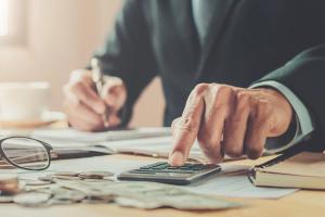 annuity man using calculator