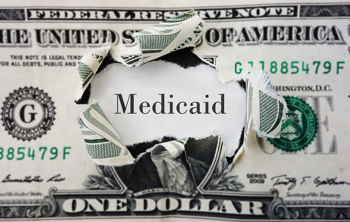 medicaid through torn dollar: © zimmytws. - stock.adobe.com