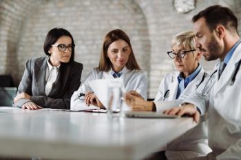physicians analyzing data business meeting © Goran - stock.adobe.com