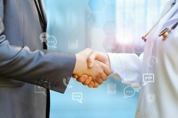 doctor shaking hands with business person