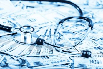 medical stethoscope on dollars: © Valeri Luzina - stock.adobe.com