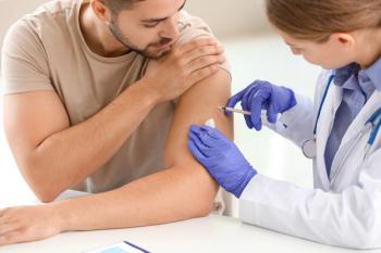 doctor physician vaccinating young man in clinic: © Pixel-Shot - stock.adobe.com