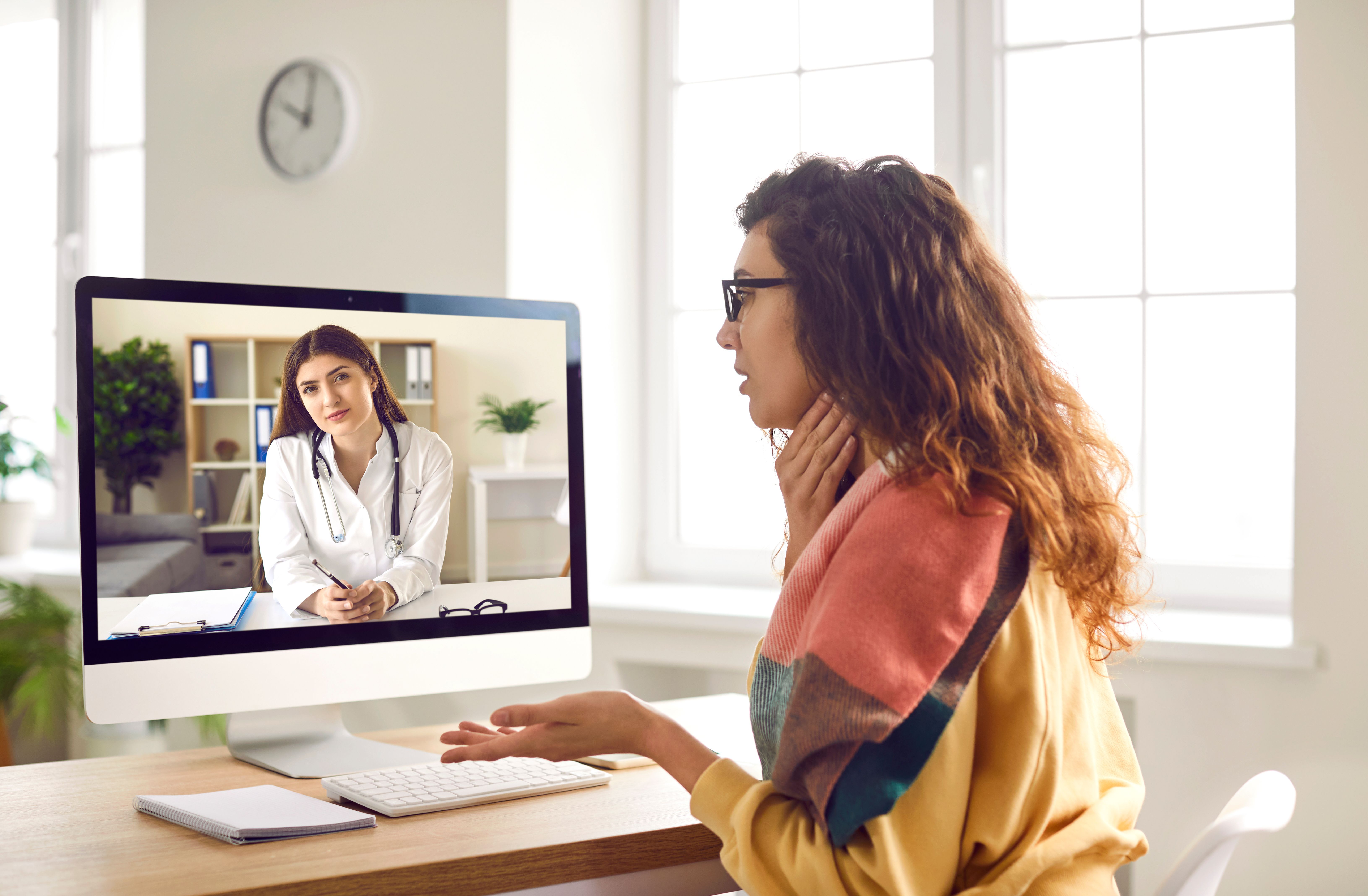 Doctor conducting e-visit with patient ©Studio Romantic-stock.adobe.com