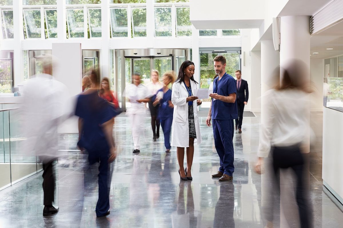staff in busy lobby modern hospital: © Monkey Business - stock.adobe.com