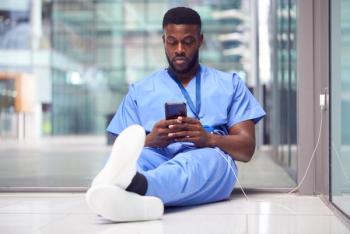 Nearly half of U.S. adults tried to cut back on phone time last year, and most came up short - Health care worker on phone © Monkey Business - stock.adobe.com