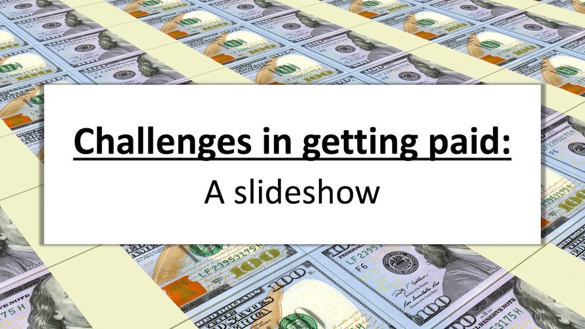 hundred dollar bills laid out