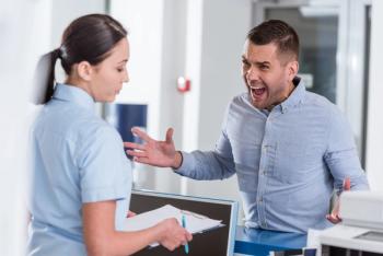 Angry patient confronting practice staff member 