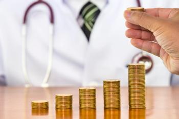 physician gold coin stacks © holwichaikawee - stock.adobe.com