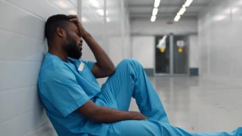 exhausted resident sitting on hospital floor ©nimito-stock.adobe.com
