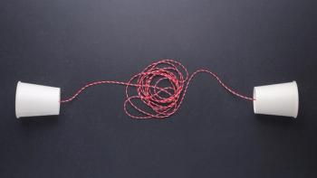 two cups connected by string communication concept
