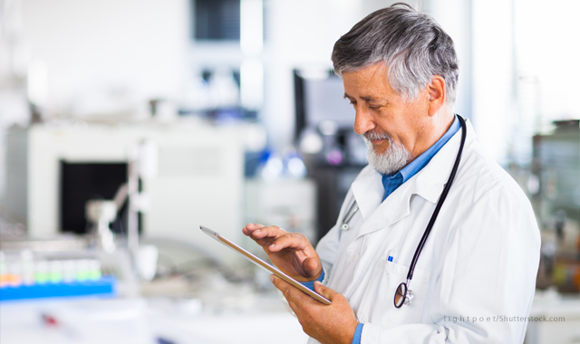 doctor holding help wanted sign