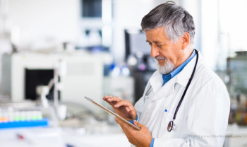 doctor holding help wanted sign