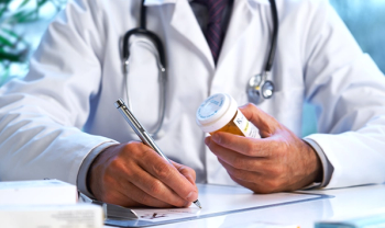 Doctor writing prescription ©18percentgrey -stock.adobe.com