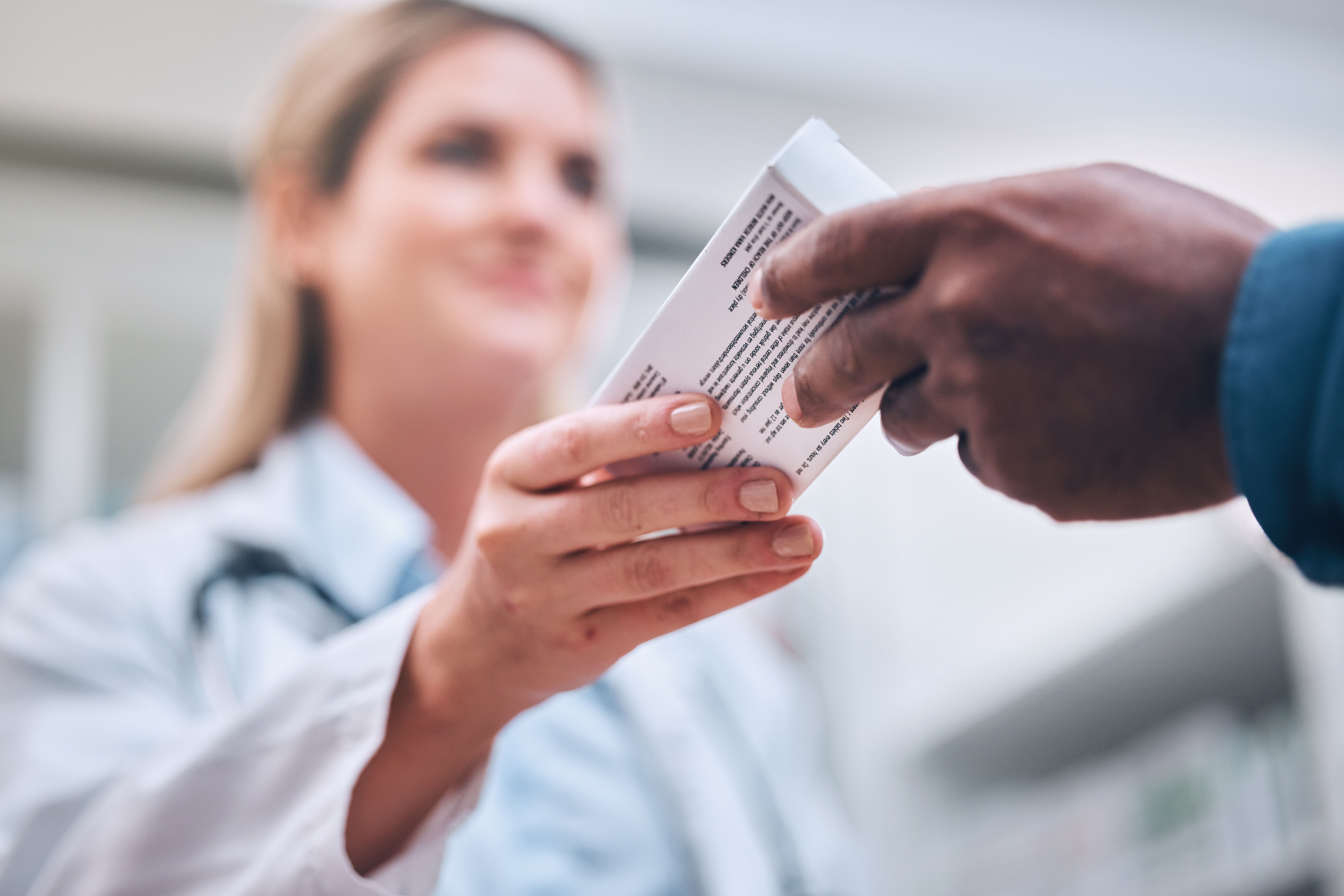 Pharmacist handing medication to customer ©J Bettencourt/peopleimages.com -stock.adobe.com