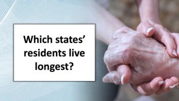 elderly hand held by younger hand