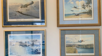 Dr. Jeffrey Weber shows his WWII aviation art collection.