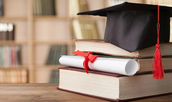 graduation cap and books